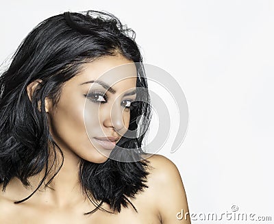 Beautiful young woman`s face with gorgeous black hair Stock Photo