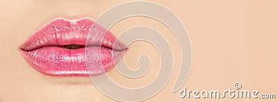 Beautiful young woman`s lips closeup, on beige background. Plastic surgery, fillers, injection. Part of the model girl face Stock Photo