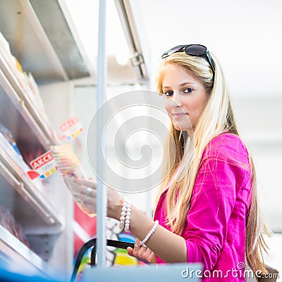 Beautiful young woman shopping in a grocery store/supermarket Stock Photo