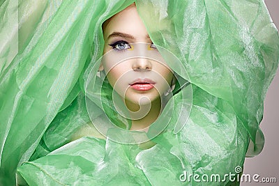 Beautiful young woman in silk veil Stock Photo