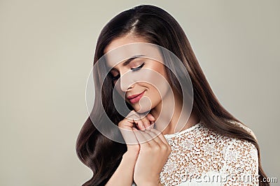 Beautiful Woman with Silky Hair wearing White Lacy Cloth Stock Photo