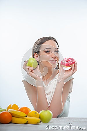 Beautiful young woman is sitting with healthy and Stock Photo