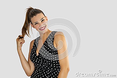 Young and beautiful woman on a white background with a nice and flirtatious pose Stock Photo