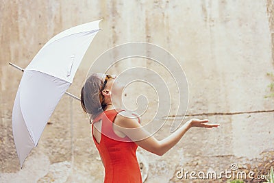 Beautiful young woman under white umbrella Stock Photo