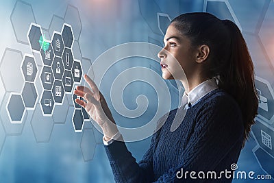 Beautiful young woman is using innovative technologies in order to study about management and run a modern business Stock Photo