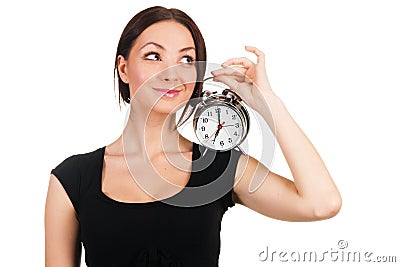 Beautiful young woman with vintage alarm clock Stock Photo