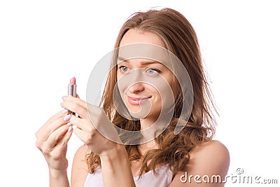 Beautiful young woman wearing lipstick in hand Stock Photo