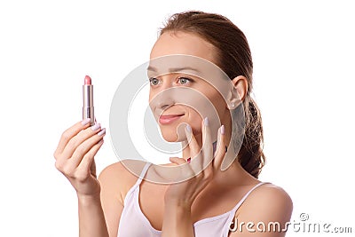 Beautiful young woman wearing lipstick in hand Stock Photo