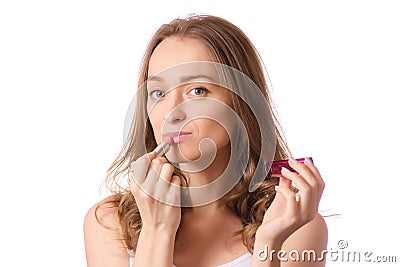 Beautiful young woman wearing lipstick in hand Stock Photo