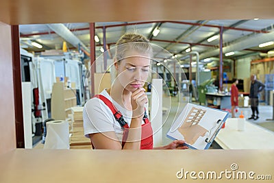 Beautiful young woman worker furniture store Stock Photo