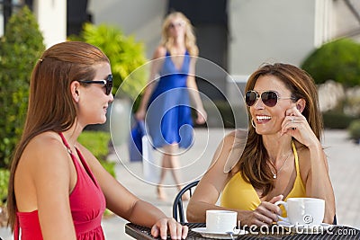 Beautiful Young Women Drinking Coffee At Cafe Stock Photo