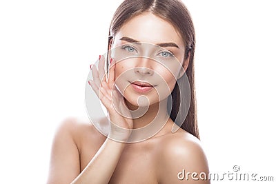 Beautiful young girl with a light natural make-up and perfect skin. Beauty face. Stock Photo