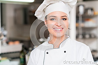 A beautifull young female chef posing for camera Stock Photo