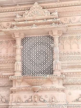 A beautifully carved ornate window at a Hindu temple in India Stock Photo