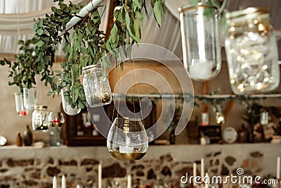 Banquet. candle and branch decoration with leaves Stock Photo