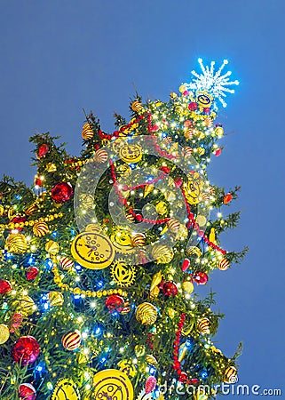 Beautifully decorated Christmas tree against the background of the night sky Stock Photo