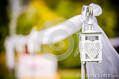 Beautifully decorated outdoor hanging wedding lantern. Wedding decor. Stock Photo