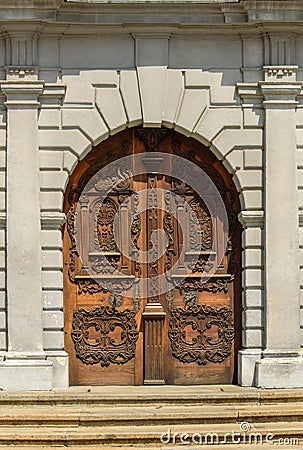 Beautifully decorated wooden door to the church Stock Photo