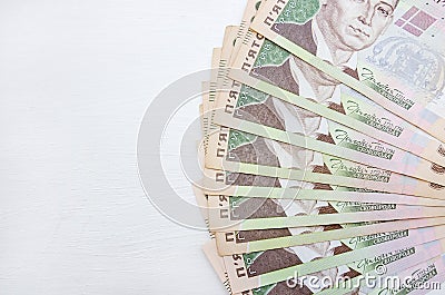 Beautifully folded hryvnia bills. White wooden background. Copy of space. 500 hryvnia Stock Photo