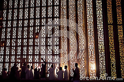 Beautifully Illuminated Mosque During Muharram with Worshippers in Prayer - Generative AI Stock Photo