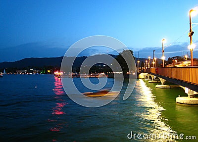 Beautifully night view in summer weather with a speedboat on Lake Zurich Stock Photo