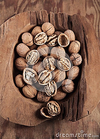 Beautifully presented walnuts on rusty wood table Stock Photo