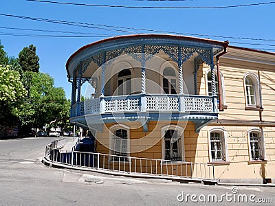 Beautifully restored heritage building with wooden ornamental balcony in Sololaki quarter, Tbilisi, Georgia. Stock Photo