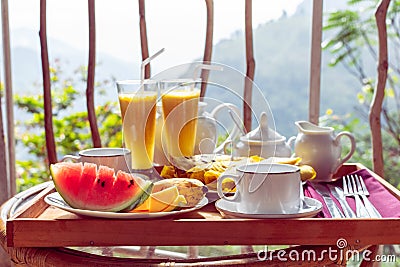 Beautifully served breakfast on terrace or balcony Stock Photo