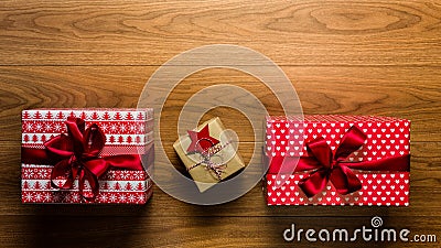 Beautifully wrapped vintage christmas presents on wooden background, view from above Stock Photo