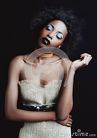 Shes an african queen. A beautiufl young african woman posing in the studio on white. Stock Photo