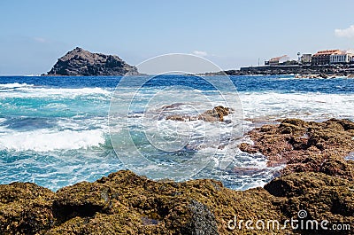 Beautiul seascape on Tenerife island. Rocks with algae, clear blue water and waves of Atlantic ocean. Tenerife, Canary island, Stock Photo