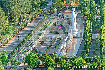 Beauty architecture leads to Lord Buddha statue shining in Dai Tong Lam Pagoda Editorial Stock Photo