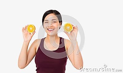 Beauty asian japanese woman hold Oranges.Beauty concept. Beautiful Joyful teen girl with freckles, funny red hairstyle and yellow Stock Photo