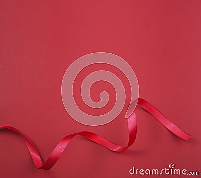 Beauty background, red curled ribbon on empty space backdrop.Valentine`s,mother`s day.Christmas decoration Stock Photo