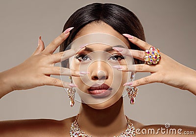 Beauty black skin woman African Ethnic female face. Luxury Young african american model with jewelry, earrings and ring Stock Photo