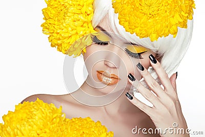 Beauty Blond Female Portrait with yellow flowers. Beautiful Spa Stock Photo