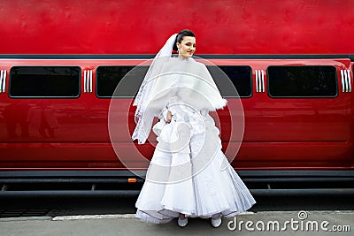 Beauty bride on background red limo car Stock Photo