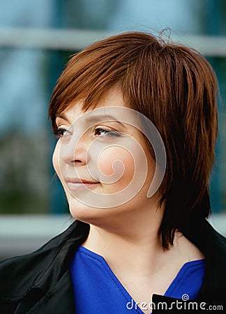 Beauty brunette mature woman outside, business Stock Photo