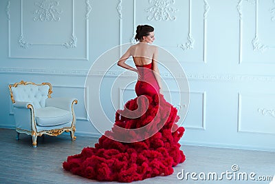 Beauty brunette model woman in evening red dress. Beautiful fashion luxury makeup and hairstyle. Seductive girl Stock Photo