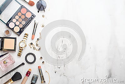 Beauty concept in a blog. Professional female make-up accessories, watch, bracelet, lipstick, brush, powder, on a marble Stock Photo