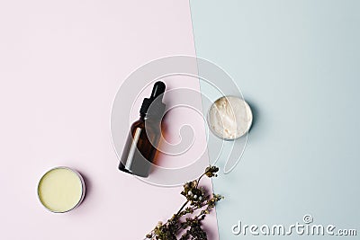 Beauty cosmetic skin care cream serum background. Products with dried flower, leaves on table top view, flat lay. minimal modern. Stock Photo