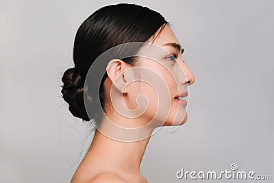 Beauty and Cosmetics Concept-Side face of Youthful pretty young Asian woman on gray background Stock Photo