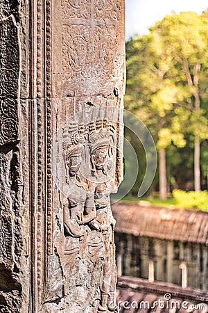 Beauty Dancing Apsaras an old Khmer art sand stone carving of Apsara status on the wall at world heritage, Siem Reap, Cambodia Stock Photo