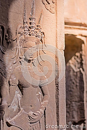 Beauty Dancing Apsaras an old Khmer art sand stone carving of Apsara status on the wall at world heritage, Siem Reap, Cambodia Stock Photo