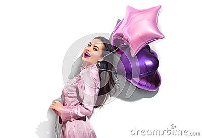 Beauty fashion model party girl with heart shaped air balloons having fun. Birthday party, Valentines Day Stock Photo