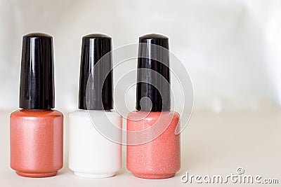Beauty, fashion and Nail art concept. Manicure art cosmetic tools of three bottles pink white beige gel nail polish. with copy spa Stock Photo