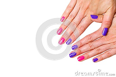 Beauty, fashion and Nail art concept. Manicure in nail spa salon -woman hands close-up with colored pink and purple gel nail polis Stock Photo