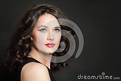 Beauty fashion portrait of pretty woman with makeup and healthy hair on blackbackground Stock Photo