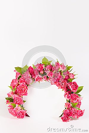 Beauty fresh pink roses as framing of circle arch on white scene mockup for display cosmetics, goods, advertising, design. Stock Photo