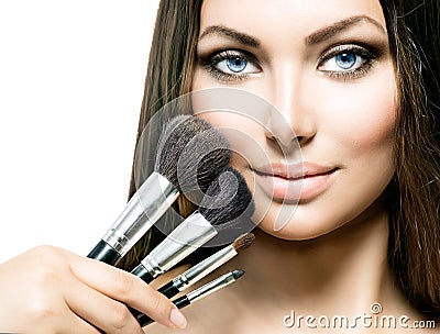 Beauty Girl with Makeup Brushes Stock Photo